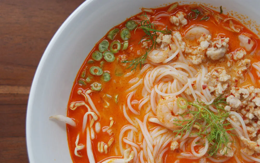 khao-pun-fermented-rice-noodles-served-in-a-spicy-broth-with-vegetables-herbs-and-crushed-peanuts khao-pun-fermented-rice-noodles-served-in-a-spicy-broth-with-vegetables-herbs-and-crushed-peanuts